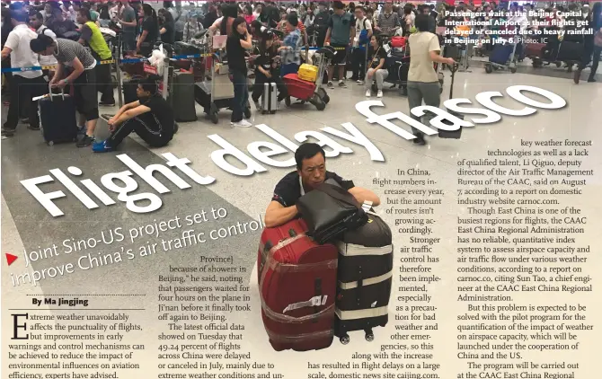  ?? Photo: IC ?? Passengers wait at the Beijing Capital Internatio­nal Airport as their flights get delayed or canceled due to heavy rainfall in Beijing on July 6.