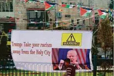  ?? AFP ?? A banner in Nablus bears an image of Donald Trump and a slogan against his intention to move the US embassy from Tel Aviv to Jerusalem on Thursday.