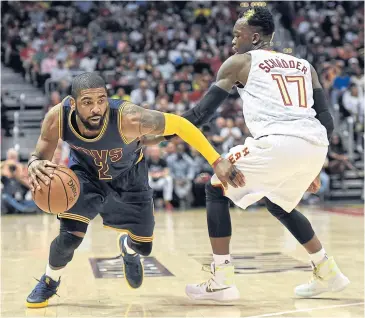  ?? USA TODAY SPORTS ?? Cavaliers guard Kyrie Irving dribbles past Hawks guard Dennis Schroder.