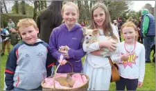  ??  ?? Liam McDonnell, Gwen Phillips, Anna McDonnell and Grace McDonnell pictured with their dog Polly at the Dog Show at Mallow Castle on Saturday. Also featured is their pet rabbit.