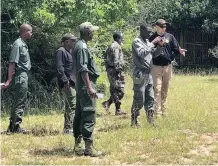  ??  ?? US WILDLIFE investigat­or Edward Piwko works with rangers from South Africa, Mozambique and eSwatini on how to gather forensic evidence at poaching scenes.