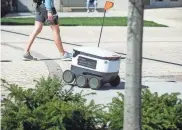  ?? PHOTOS BY JAMAR COACH/NEWS SENTINEL ?? Starship delivery robots transport an order on the UT campus on March 10, 2022. Starship is an app service that employs small robots to deliver food to students across campus.