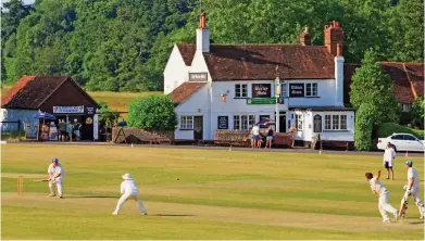  ??  ?? Howzat! The pretty cricket ground in the village of Tilford, where writer J.M. Barrie lived