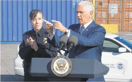  ?? KEVIN RICHARDSON/BALTIMORE SUN ?? Vice President Mike Pence speaks with Customs and Border Protection officers at the Port of Baltimore. Standing behind him is Casey Owen Durst, director of field operations of the Baltimore field office of U.S. Customs and Border Protection.