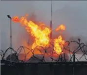  ?? REUTERS ?? Fire burns at a fuel storage site after shelling in Makiivka in Russian-controlled Ukraine, on Monday.