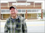  ?? Submitted ?? Charlie Bookout, one of the owners of The Carpenter Building in Gentry, stands in front of the building on Friday. The building is being nominated for inclusion on the National Register of Historic Places.