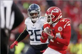  ?? JEFF ROBERSON — THE ASSOCIATED PRESS ?? Kansas City Chiefs’ Sammy Watkins catches a touchdown pass in front of Tennessee Titans cornerback Logan Ryan during the AFC Championsh­ip.
