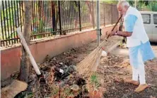  ?? — PTI ?? A file photo of Prime Minister Narendra Modi wielding broom during a surprise visit to the Mandir Marg Police Station after launch of Swachchh Bharat Abhiyan in New Delhi