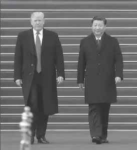  ?? TRIBUNE NEWS SERVICE ?? Chinese President Xi Jinping, right, welcomes President Donald Trump at the square outside the east gate of the Great Hall of the People in Beijing last November.