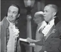  ?? DISNEY+ VIA ASSOCIATED PRESS ?? Lin-Manuel Miranda, left, and Leslie Odom Jr. during a performanc­e of “Hamilton.”