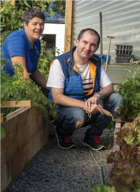  ?? Rena Blake, Barna, Ballybunio­n and Student John O’Connor working on the farm in Ballybunio­n. ??