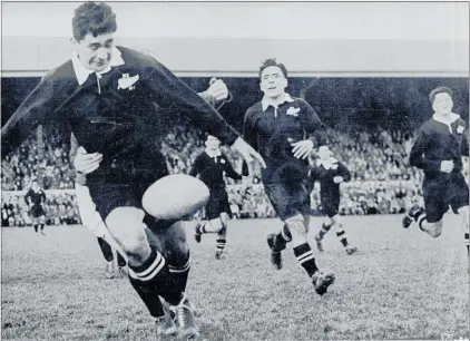  ?? PICTURES/NEW ZEALAND RUGBY MUSEUM ?? Percy Erceg gets tackled whilst playing for the New Zealand Maori against the British Lions in their 1951 New Zealand tour.