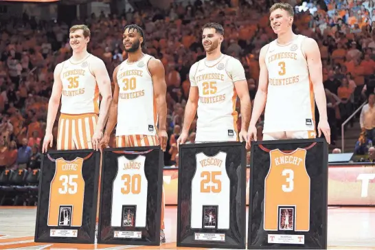  ?? CAITIE MCMEKIN/NEWS SENTINEL ?? From left, Tennessee honors senior players — forward Colin Coyne, guard Josiah-Jordan James, guard Santiago Vescovi and guard Dalton Knecht — before their March 9 basketball game against Kentucky in Knoxville.