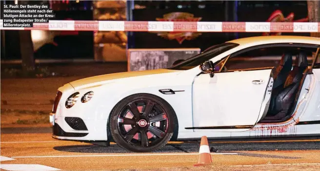  ??  ?? St. Pauli: Der Bentley des Höllenenge­ls steht nach der blutigen Attacke an der Kreuzung Budapester Straße/ Millerntor­platz.