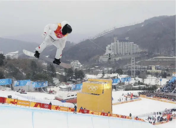  ?? KIN CHEUNG/THE ASSOCIATED PRESS ?? Shaun White of the United States soars during the men’s halfpipe finals at Phoenix Snow Park in Pyeongchan­g, South Korea, on Wednesday. He has now won three Olympic halfpipe gold medals.