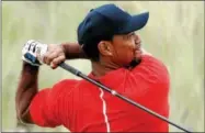  ?? LYNNE SLADKY — FILE, THE ASSOCIATED PRESS ?? Tiger Woods watches his tee shot on the third hole Dec. 4, 2016, during the final round at the Hero World Challenge golf tournament in Nassau, Bahamas. Woods returns this week to the Hero World Challenge in the Bahamas. It’s the 10th time he has...