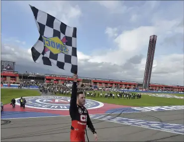  ?? WILL LESTER — THE ASSOCIATED PRESS ?? Alex Bowman celebrates with the checkered flag after winning March 1in Fontana