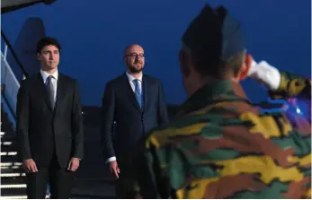  ?? CP PHOTO ?? Prime Minister Justin Trudeau stands with Belgium Prime Minister Charles Michel as he is greeted by an honour guard as he arrives in Brussels, Belgium on Wednesday to attend the NATO Summit.
