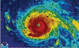  ?? NOAA 2017 ?? A satellite view of Category 5 Hurricane Irma as it began to impact the northern Leeward Islands with 185-mph winds on Sept. 5 last year.