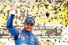  ?? AP Photo/John Locher ?? ■ Kyle Larson celebrates after winning a NASCAR Cup Series auto race Sunday in Las Vegas.