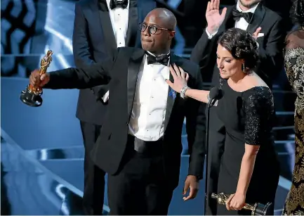  ?? PHOTOS: REUTERS ?? Director Barry Jenkins and producer Adele Romanski celebratin­g the best picture win for Moonlight at the 89th Academy Awards.