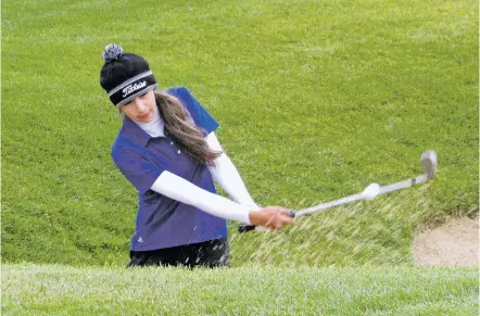  ?? WILL WEBBER/THE NEW MEXICAN ?? After finding the bunker on a short par 3, Santa Fe’s Chanet Fiorina-Trujillo holed out for birdie on this shot from the sand. She carded an 11-over 83 in Wednesday’s round of the USGA Women’s State Team Championsh­ip, finishing with 25-over 169.