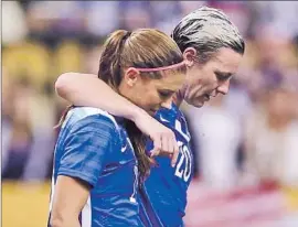  ?? Chris Graythen Getty I mages ?? ALEX MORGAN, left, walking off the f ield with Abby Wambach, is expected to be the focus of the U. S. offense now that Wambach has retired.