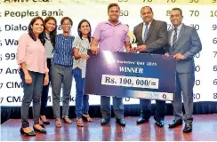  ??  ?? The Winning Team -Hemas Manufactur­ing (Pvt) Ltd receiving their award and prize from the Chief Guest Dr. Prasad Medawatte, the GCEO of Lanka Hospitals PLC and Mr. Pradeep Edward,the President of SLIM.