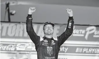  ?? ISAAC BREKKEN/ASSOCIATED PRESS ?? Chevrolet driver Kurt Busch celebrates Sunday night after his first victory at his home track of Las Vegas.