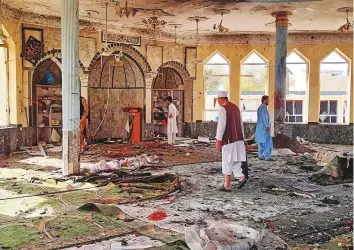  ?? AP ?? The mosque in Kunduz following the attack. The explosion tore through the mosque during Friday prayers, blowing out windows, charring the ceiling and leaving bodies in its wake.