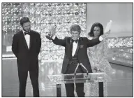  ?? (AP) ?? Burt Bacharach accepts the Oscar for best original score for “Butch Cassidy and the Sundance Kid” in 1970. He shared another Oscar that year as well for “Raindrops Keep Falling on My Head” from the movie.