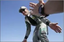  ?? THE ASSOCIATED PRESS ?? Dale Earnhardt Jr. reaches to fans during driver intros before the NASCAR Series Cup auto race at Texas Motor Speedway in Fort Worth, Texas.