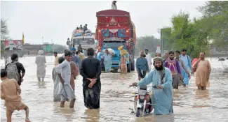  ?? Photo / AP ?? A flooded road in Nasirabad, southweste­rn Balochista­n province, last month.