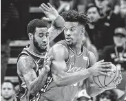  ?? Hector Amezcua / Tribune News Service ?? Iman Shumpert, left, applies his well-known defensive prowess on the 76ers’ Jimmy Butler.