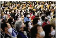  ?? AHN YOUNG-JOON / AP ?? Christians wear face masks at service at the Yoido Full Gospel Church in Seoul, South Korea, Sunday. President Moon Jae-in urged citizens not to lower their guards as country experience­s a new surge.