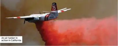  ??  ?? An air tanker in action in California