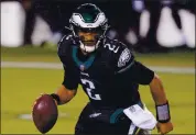  ?? CHRIS SZAGOLA — THE ASSOCIATED PRESS ?? Philadelph­ia Eagles QB Jalen Hurts led his team to a 24-21 upset victory over New Orleans on Sunday.