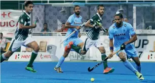  ?? PTI ?? Players of India and Pakistan in action during their match at the 10th men’s Asia Cup hockey tournament, in Dhaka on Sunday. India beat Pakistan to move to the Super 4s stage. —