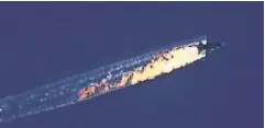  ?? HABERTURK TV CHANNEL EPA ?? An image from the HaberTurk TV channel shows a burning trail from a plane shot down near the Turkish- Syrian border.