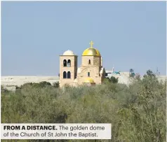  ?? ?? FROM A DISTANCE. The golden dome of the Church of St John the Baptist.