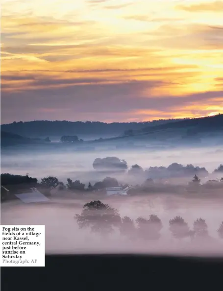  ??  ?? Fog sits on the fields of a village near Kassel, central Germany, just before sunrise on Saturday Photograph: AP