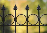  ?? ?? TOP Finials top a wrought-iron fence.