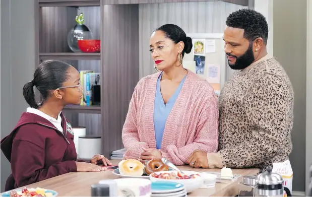  ?? — ABC ?? Characters played by Marsai Martin, left, Tracee Ellis Ross and Anthony Anderson on the hit television sitcom black-ish are forced to deal with a fraught topic after daughter Diane, played by Martin, isn’t lit properly in her class photo, appearing darker than she is.