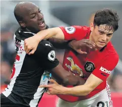  ??  ?? Tussle: Jetro Willems battles for possession with Daniel James