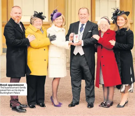  ??  ?? Royal appointmen­t The businessma­n’s family joined him on his trip to Buckingham Palace