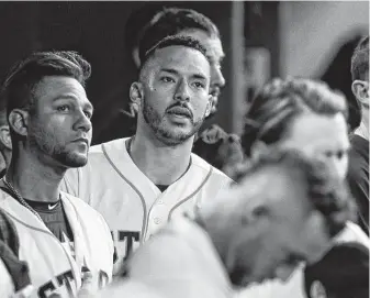  ?? Karen Warren / Staff photograph­er ?? Carlos Correa, center, alerted his Astros teammates during Game 5 that Red Sox David Price pitcher was on his game and utilizing “the best changeup we had ever faced from him.”