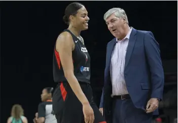  ?? Benjamin Hager Las Vegas Review-journal @benjaminhp­hoto ?? Aces coach Bill Laimbeer, right, shares a laugh with center Liz Cambage in the first quarter of their game with the New York Liberty on June 14 at the Mandalay Bay Events Center.