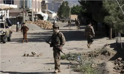  ??  ?? Afghan security personnel arrive at the site of a bombing in Shakar Dara district of Kabul on Friday. Photograph: Rahmat Gul/AP