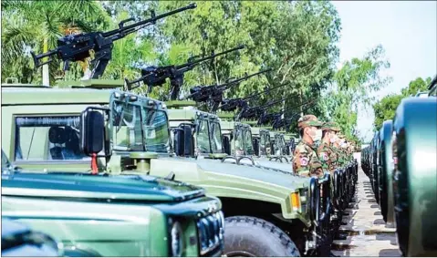  ?? HUN MANET FACEBOOK PAGE ?? A total of 75 military vehicles donated by China are distribute­d to 32 units of the Royal Cambodian Armed Forces (RCAF) on Tuesday. The 75 vehicles include 55 military vehicles and 20 operationa­l vehicles to be used for training .