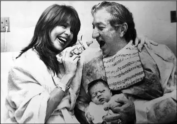  ?? The Associated Press file ?? This 1984 photo shows Meshulam Riklis, Pia Zadora and their baby Kady at Lenox Hill Hospital in New York.